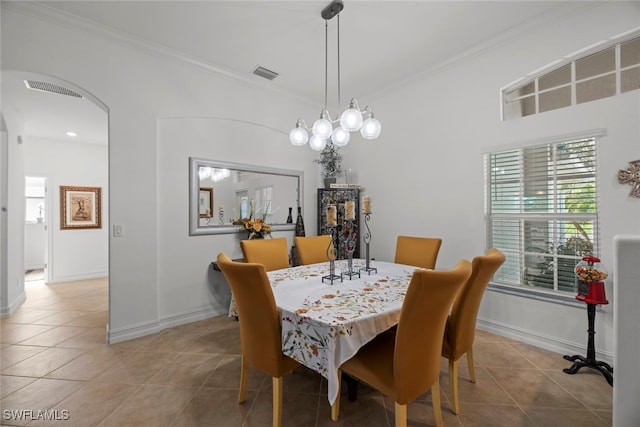 tiled dining room with crown molding