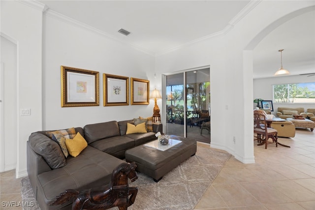 living room with crown molding and light tile patterned flooring