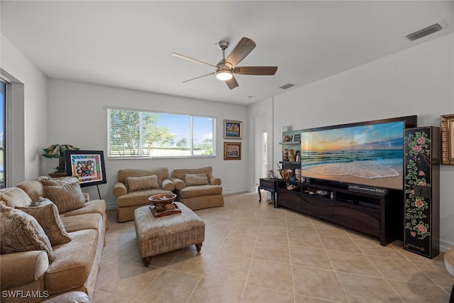 tiled living room featuring ceiling fan