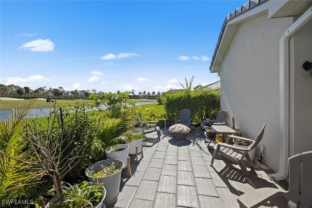 view of patio featuring a water view