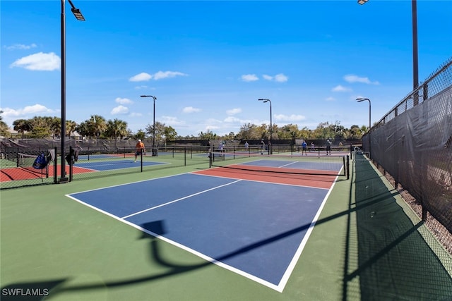 view of tennis court featuring basketball court