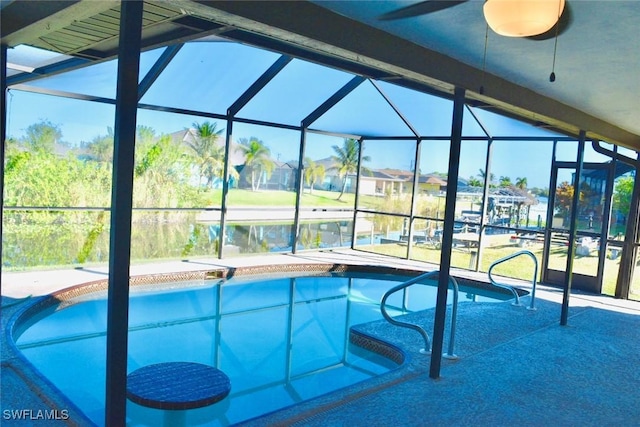 view of swimming pool with ceiling fan and a patio