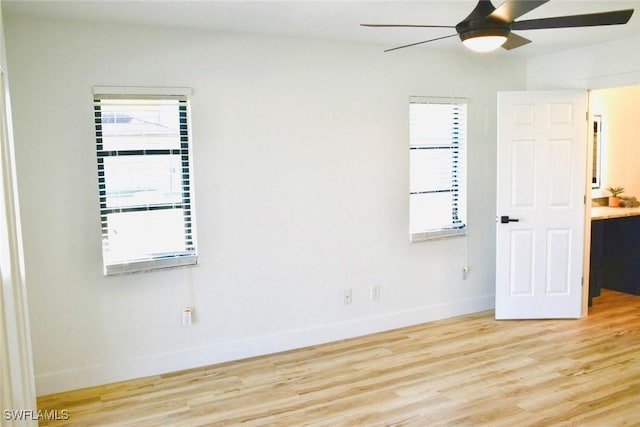 unfurnished room with ceiling fan and light hardwood / wood-style floors