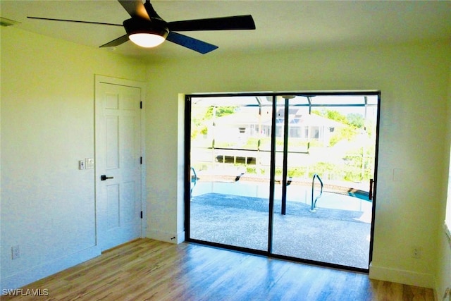 spare room with ceiling fan and light hardwood / wood-style floors