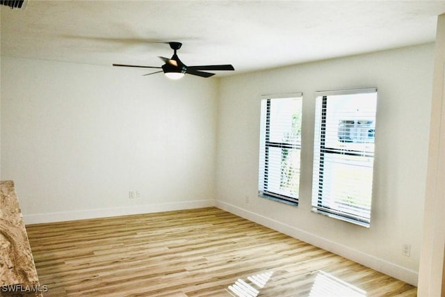 unfurnished room with light hardwood / wood-style floors and ceiling fan