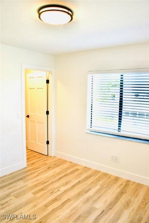 empty room with light hardwood / wood-style floors