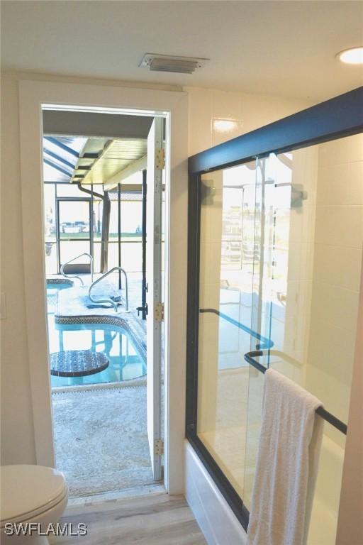 doorway featuring hardwood / wood-style floors and a wealth of natural light