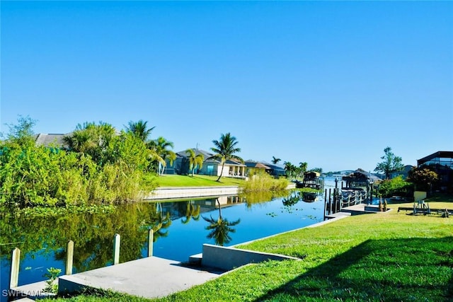 view of dock featuring a water view and a lawn