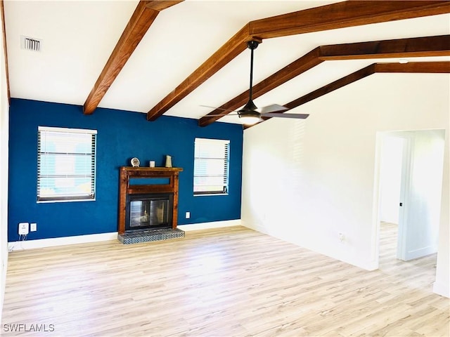 unfurnished living room with ceiling fan, lofted ceiling with beams, and light hardwood / wood-style floors