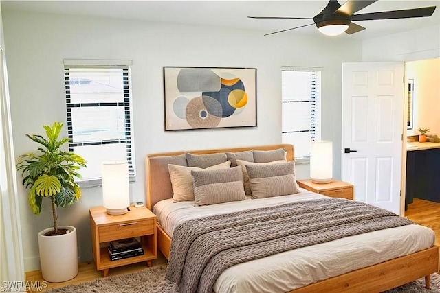 bedroom with hardwood / wood-style flooring and ceiling fan