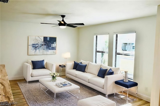 living room with hardwood / wood-style floors and ceiling fan