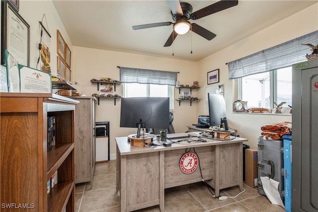 office featuring ceiling fan, a healthy amount of sunlight, and light tile patterned floors