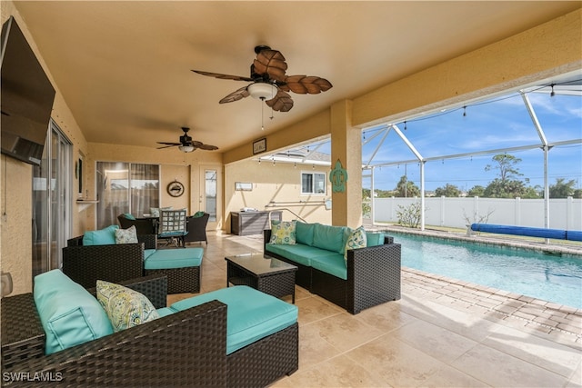 view of patio with glass enclosure, outdoor lounge area, ceiling fan, and a covered pool