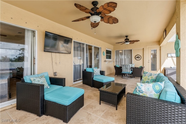 view of patio with outdoor lounge area and ceiling fan