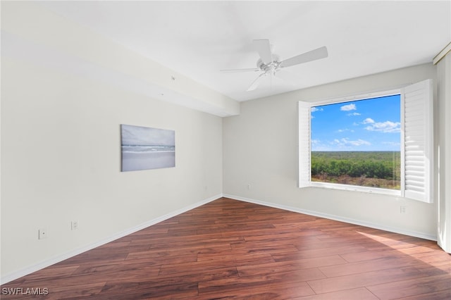 unfurnished room featuring ceiling fan and dark wood-type flooring