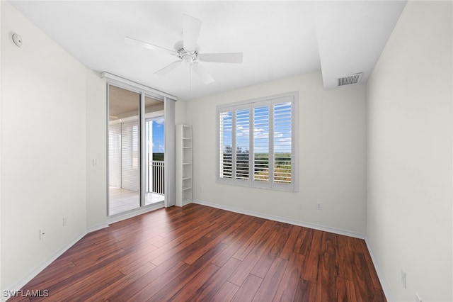 1001 Arbor Lake Dr Unit 307, Naples, FL 34110 - empty room featuring wood finished floors, baseboards, and a ceiling fan