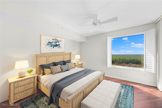 1001 Arbor Lake Dr Unit 307, Naples, FL 34110 - bedroom with wood finished floors, baseboards, and a ceiling fan