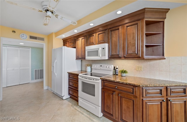 kitchen with decorative backsplash, light stone counters, white appliances, ceiling fan, and light tile patterned floors