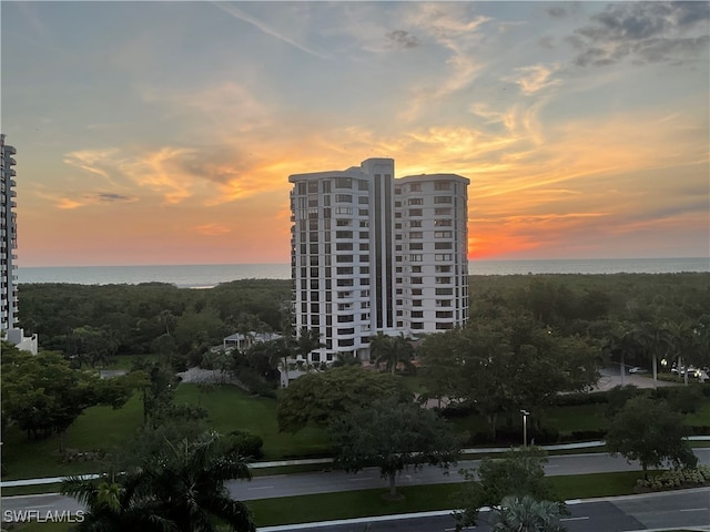 outdoor building at dusk featuring a water view