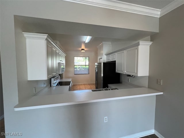 kitchen featuring sink, kitchen peninsula, white cabinetry, stainless steel appliances, and ornamental molding