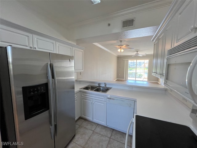 kitchen featuring stainless steel fridge, white cabinets, dishwasher, crown molding, and sink