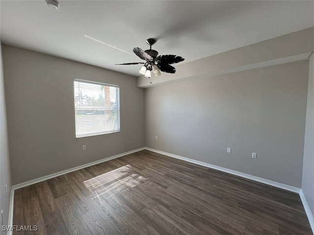 unfurnished room with ceiling fan and dark hardwood / wood-style floors