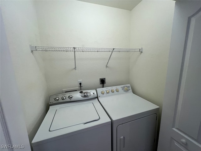 washroom with washer and clothes dryer