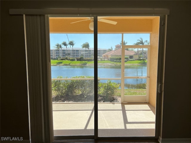 doorway with a healthy amount of sunlight and a water view