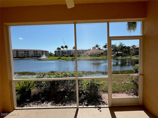 interior space with a water view and plenty of natural light