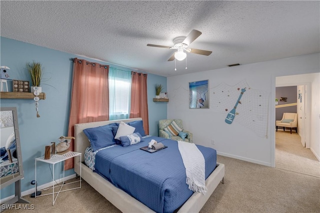 carpeted bedroom with a textured ceiling and ceiling fan