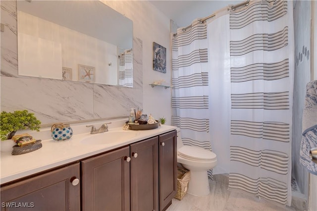 bathroom with backsplash, toilet, vanity, and a shower with shower curtain