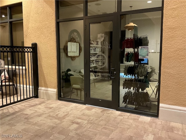 property entrance featuring french doors