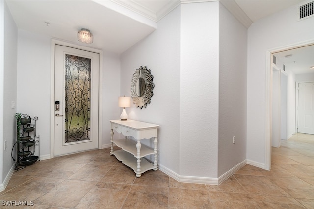 entryway with light tile patterned floors