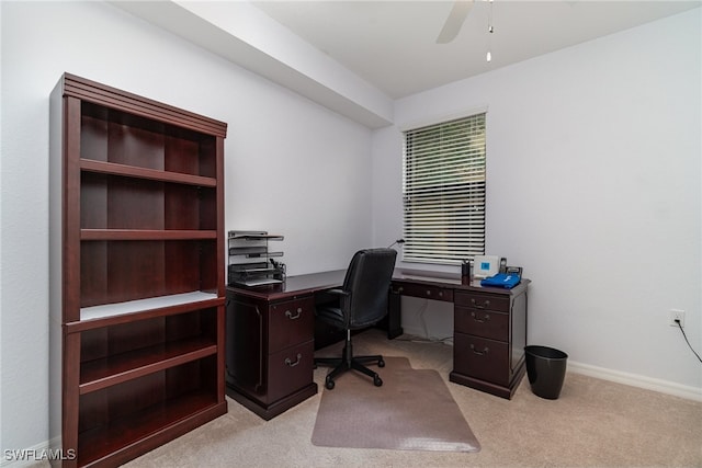 carpeted home office with ceiling fan