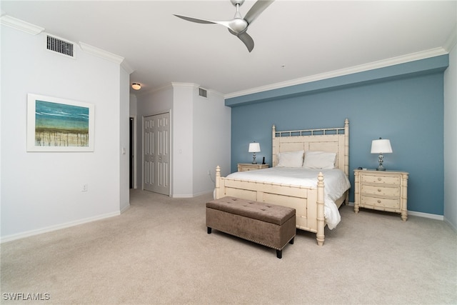 bedroom featuring ornamental molding, light colored carpet, and ceiling fan