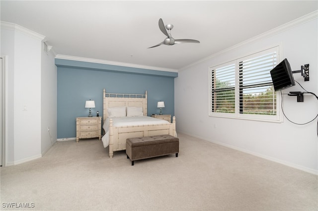 bedroom featuring carpet flooring, ornamental molding, and ceiling fan