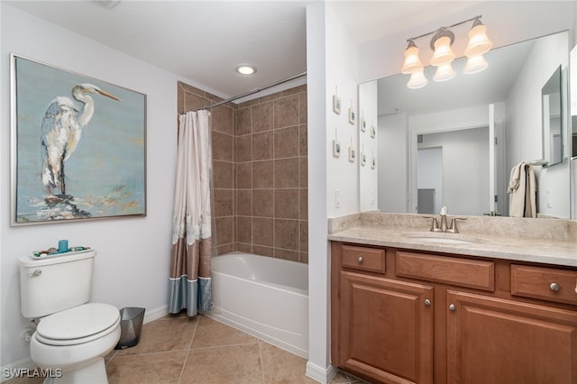 full bathroom featuring vanity, shower / bath combo with shower curtain, tile patterned floors, and toilet