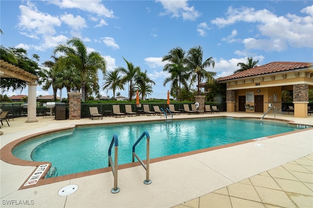 view of swimming pool with a patio