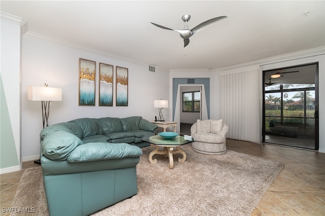 tiled living room with ceiling fan and crown molding