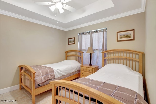 bedroom featuring ornamental molding, a tray ceiling, light tile patterned floors, and ceiling fan