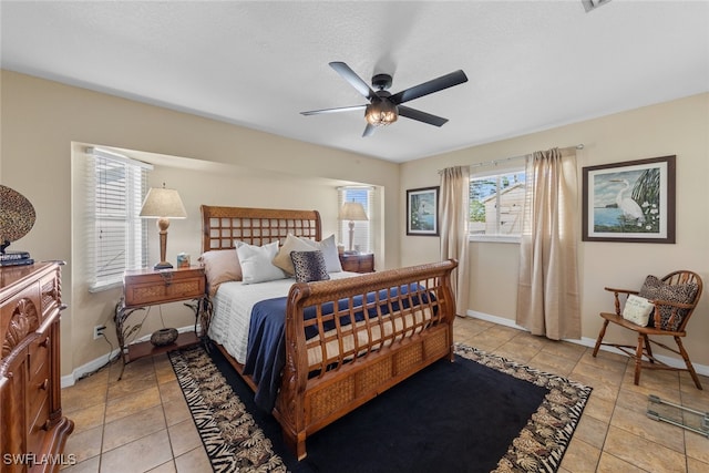 tiled bedroom with ceiling fan