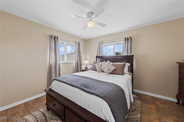 tiled bedroom with ceiling fan