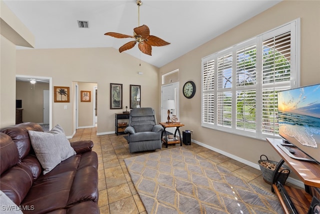 tiled living room with ceiling fan and vaulted ceiling