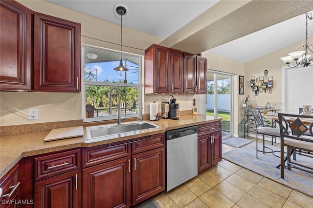 kitchen with stainless steel dishwasher, plenty of natural light, and pendant lighting