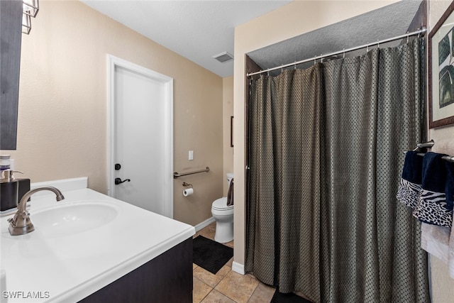 bathroom with toilet, vanity, tile patterned floors, and a shower with shower curtain