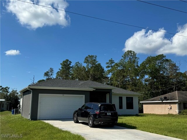 133 Greenbriar Blvd, Lehigh Acres, FL 33972 - ranch-style house featuring driveway, an attached garage, a front lawn, and stucco siding