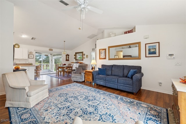 living room featuring dark hardwood / wood-style flooring, ceiling fan, and vaulted ceiling