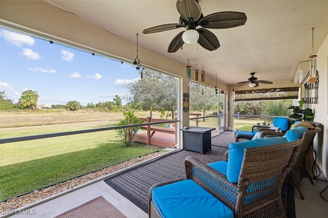 view of patio with ceiling fan and an outdoor hangout area