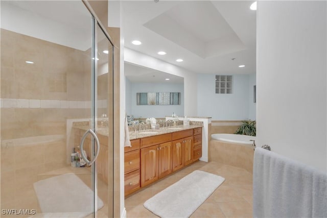 bathroom with shower with separate bathtub, vanity, and tile patterned floors