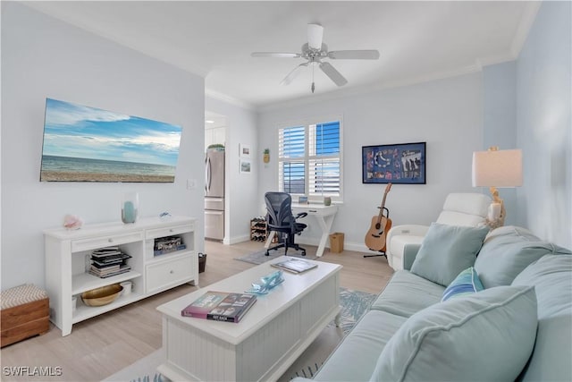 living room featuring light wood-type flooring, ceiling fan, and crown molding